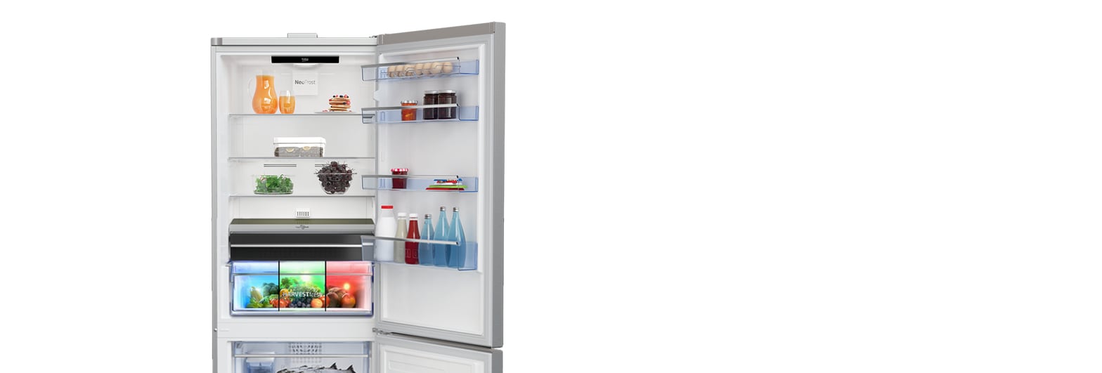 Réfrigérateur Beko avec bac à légumes HarvestFresh éclairé en bleu, vert et rouge