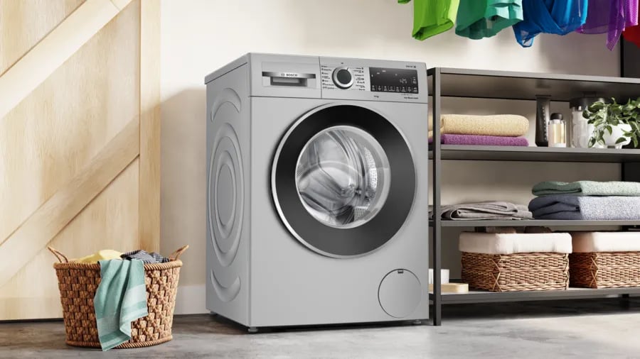 Bosch lave-linge EcoPerfect dans buanderie moderne bien organisée