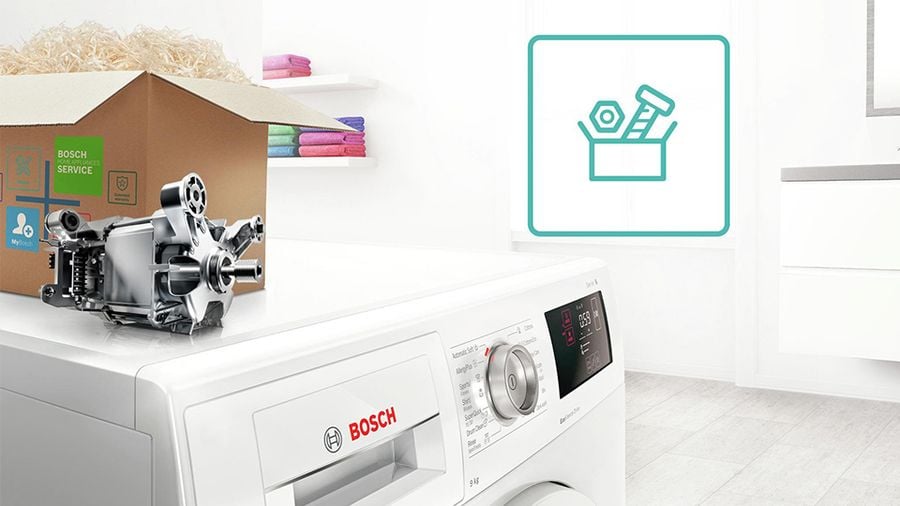 Moteur EcoSilence Drive Bosch détouré au-dessus d'un lave-linge avec carton pièces d'origine