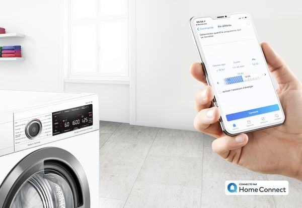 App Bosch Home Connect programmant un départ différé sur un lave-linge Serie 6
