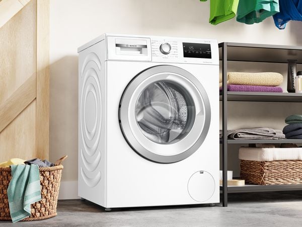 Infographie Bosch SpeedPerfect, touche dédiée sur lave-linge avec réduction jusqu'à 65% du temps de cycle