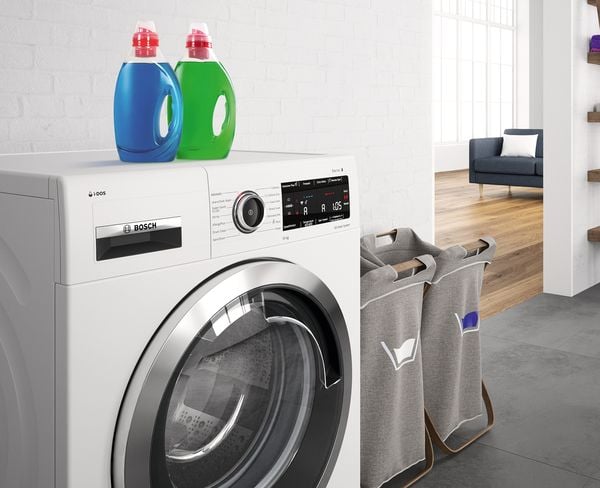 Lave-linge Bosch VarioDrum i-DOS avec lessive et paniers à linge