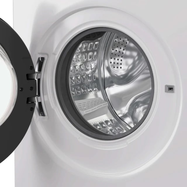Tambour intérieur en inox d'un lave-linge Candy Kg Detector, perforations de la paroi