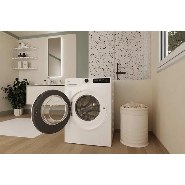 Tambour intérieur inox d'un lave-linge Candy Kg Detector, vue rapprochée de la paroi perforée