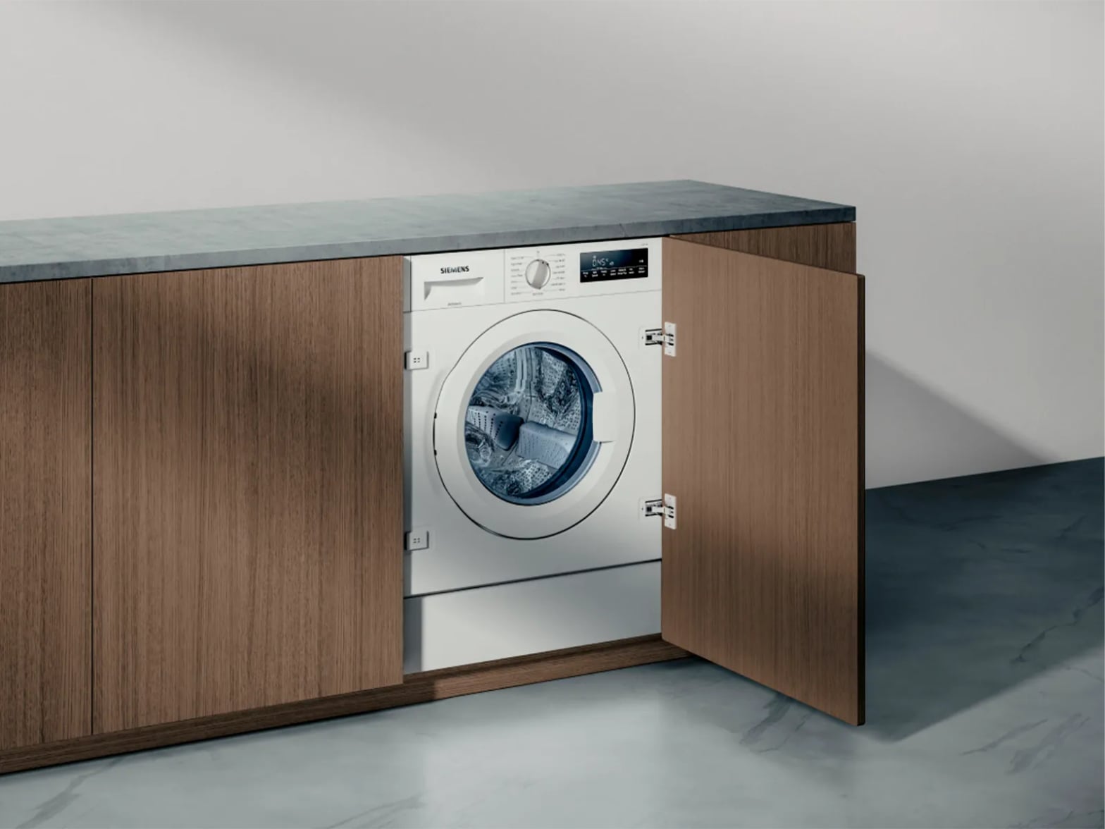 Lave-linge Siemens encastrable équipé varioPerfect dans cuisine moderne