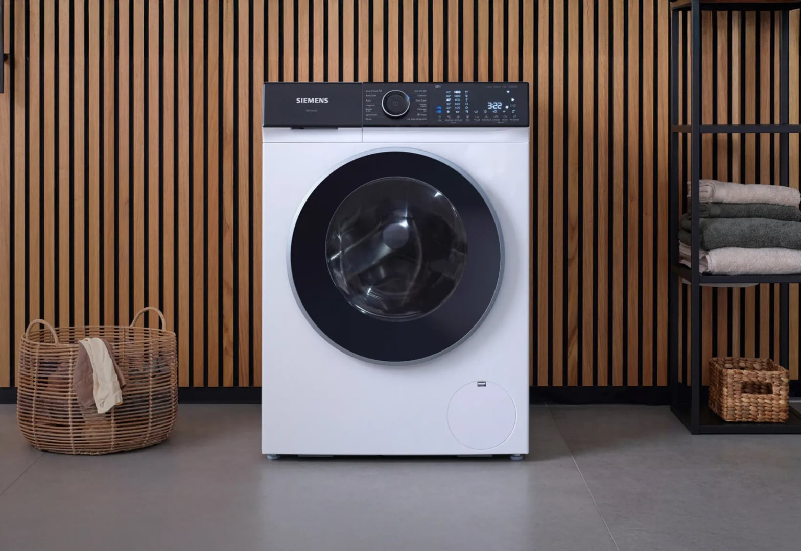 Lave-linge Siemens iSensoric avec tambour waveDrum visible à travers le hublot